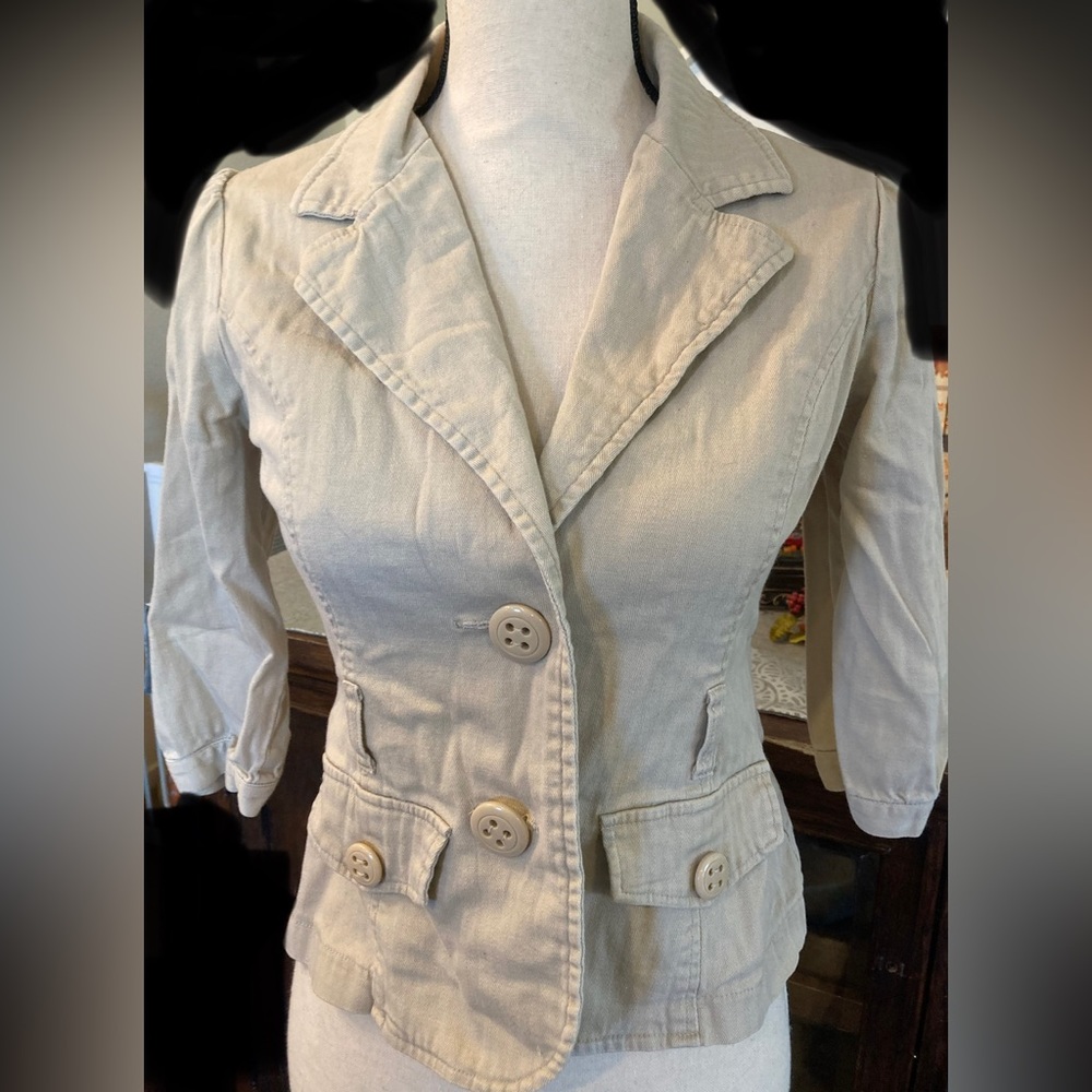 F.A.N.G. Cream blazer with oversized buttons.